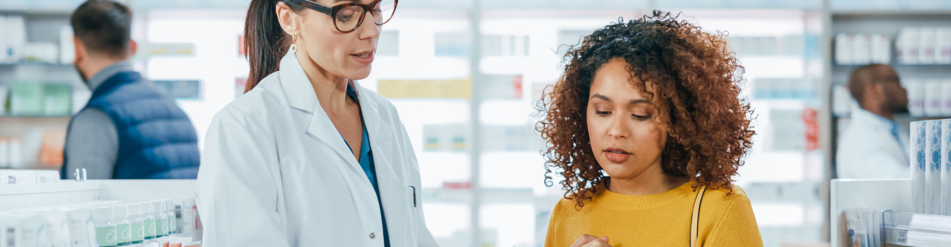 woman talking to a pharmacist