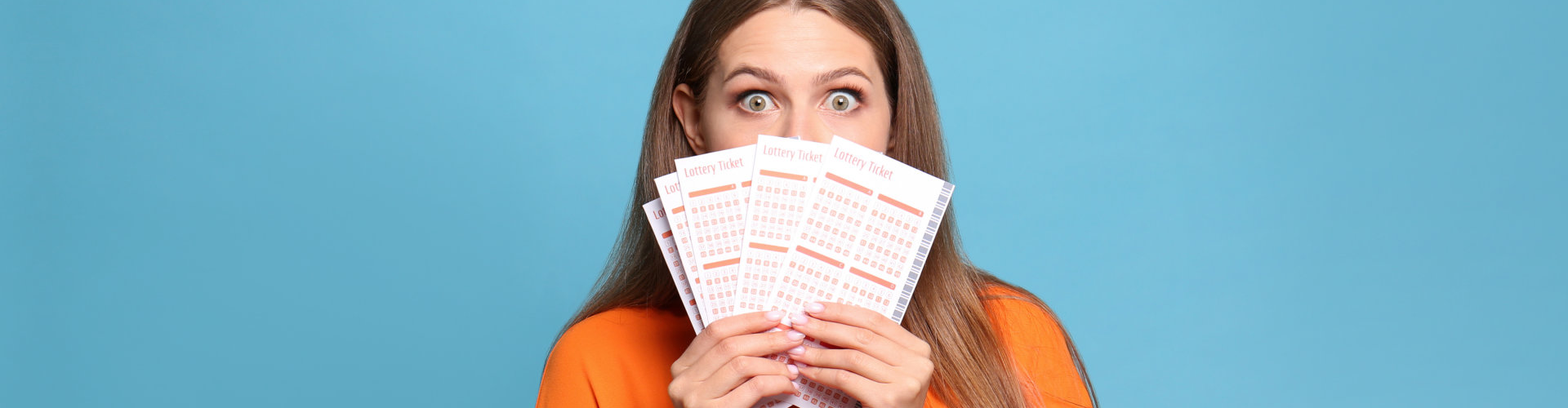 woman holding lottery tickets